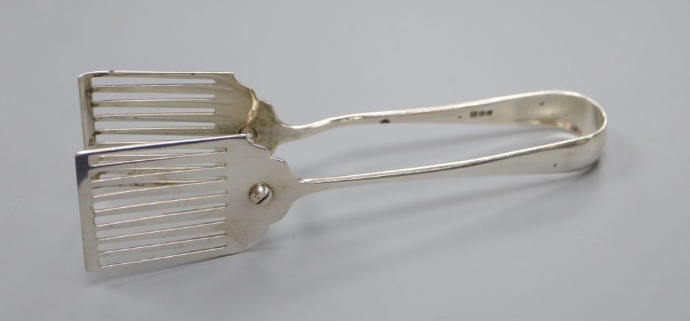 A pair of Old English pattern asparagus tongs, with pierced blades, Asprey & Co, London 1920, 4oz.